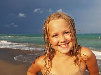 Portrait of a smiling young woman on beach