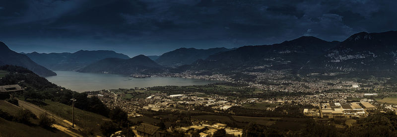 Panoramic shot of buildings and mountains against sky