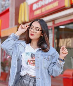 Portrait of young woman wearing sunglasses