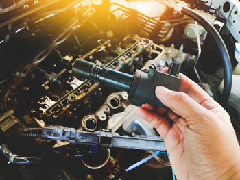 Close-up of man holding machine