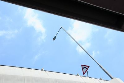 Low angle view of street light against sky