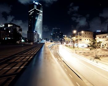 Illuminated city street at night