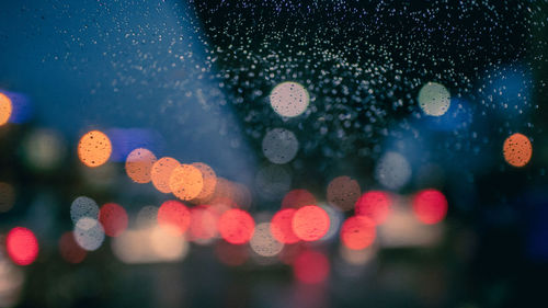 Defocused image of illuminated lights at night