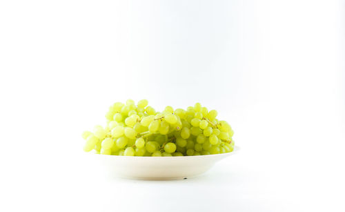 Close-up of vegetables in bowl against white background