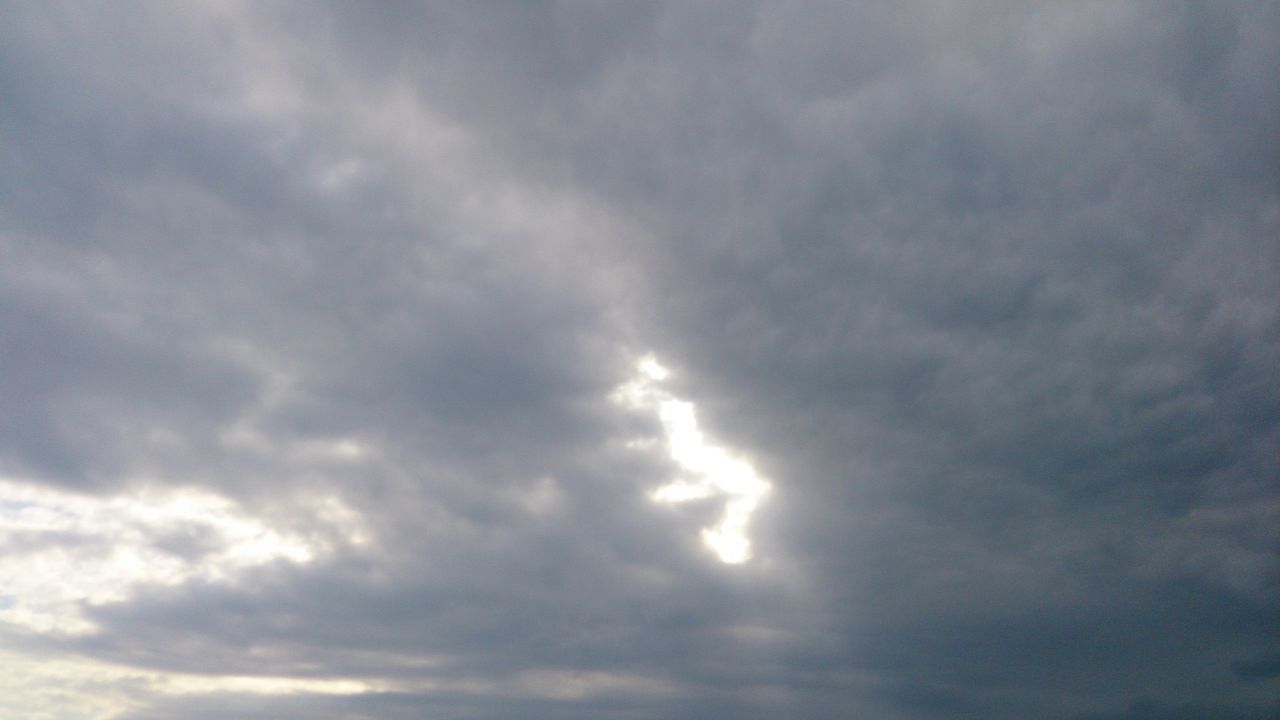 LOW ANGLE VIEW OF STORM CLOUDS OVER MOON