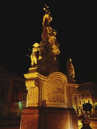 Low angle view of statue at night