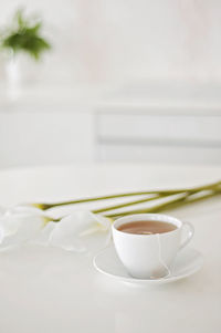 Close-up of coffee cup on table