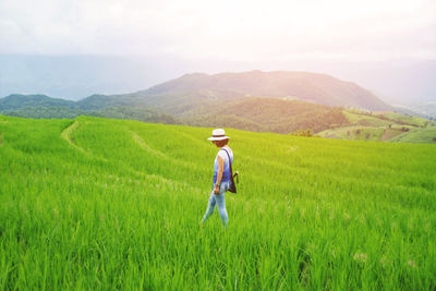 Side view of woman walking in farm