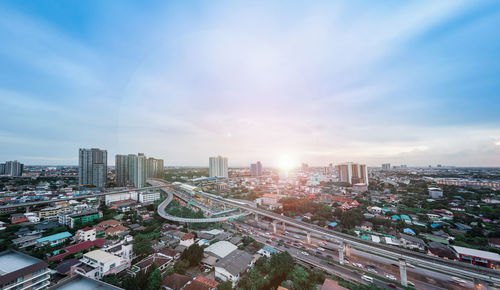 High angle view of modern buildings in city against sky