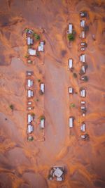 Aerial view of houses on brown landscape