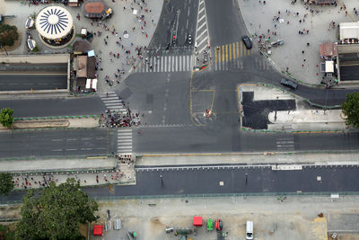 Aerial view of a city with roads people and buildings