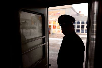 People looking through window