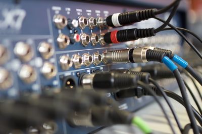 Close-up of cables connected to amplifier