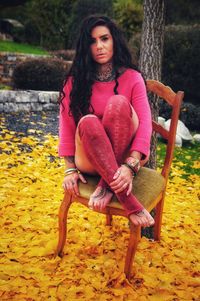 Portrait of woman sitting on seat