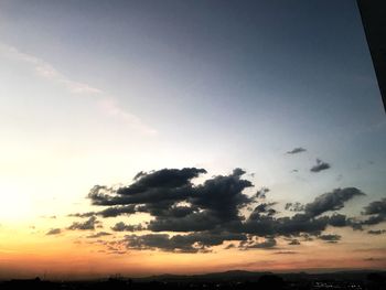 Low angle view of silhouette trees against sky during sunset