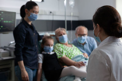 Side view of business colleagues working at clinic