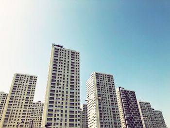 Low angle view of modern buildings against sky