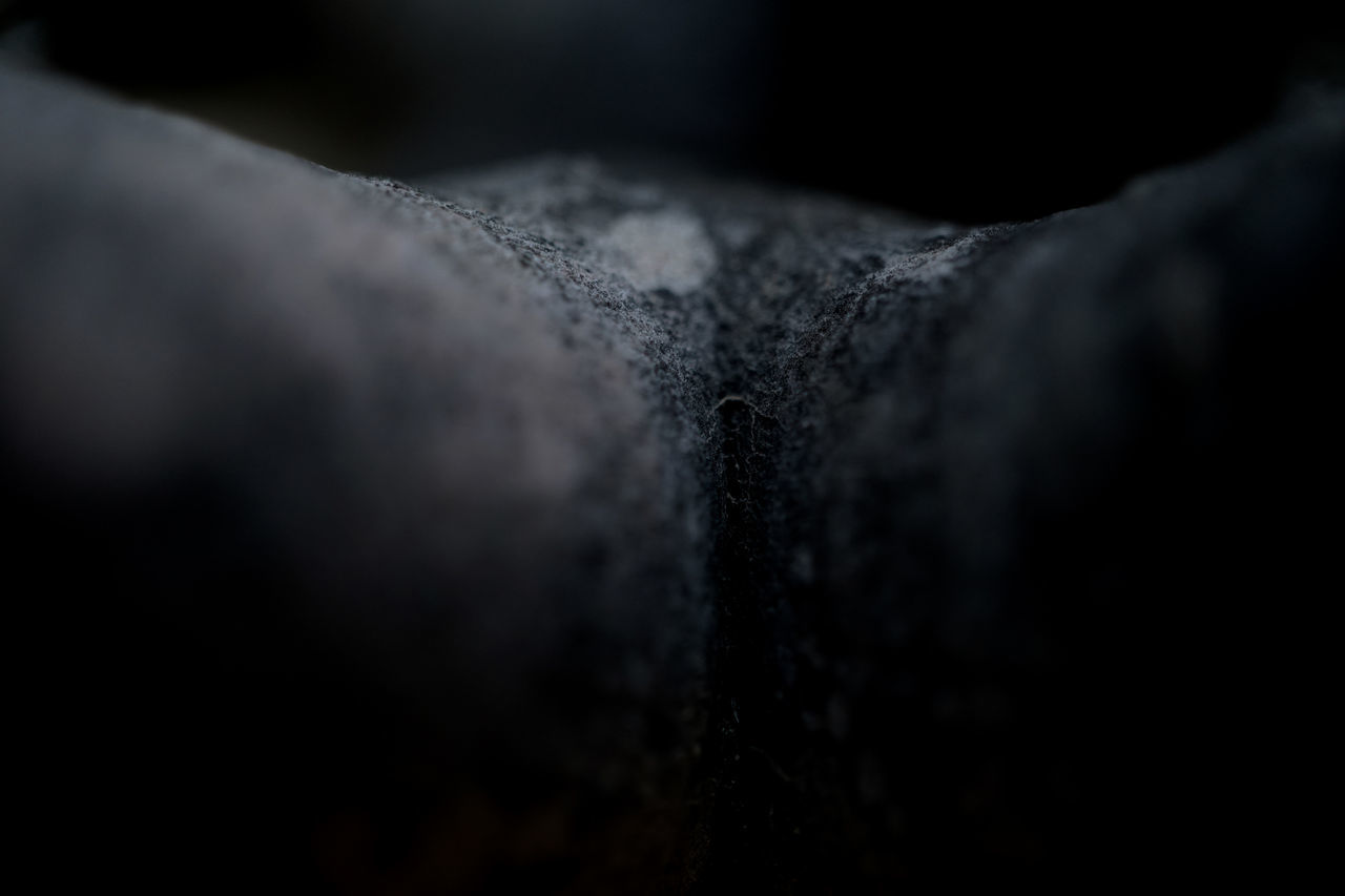 CLOSE-UP OF BLACK COFFEE ON METAL
