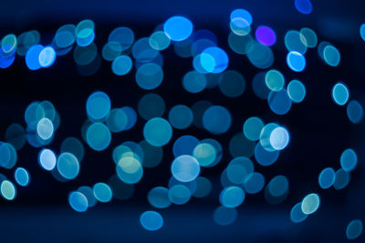 Defocused image of illuminated lights at night