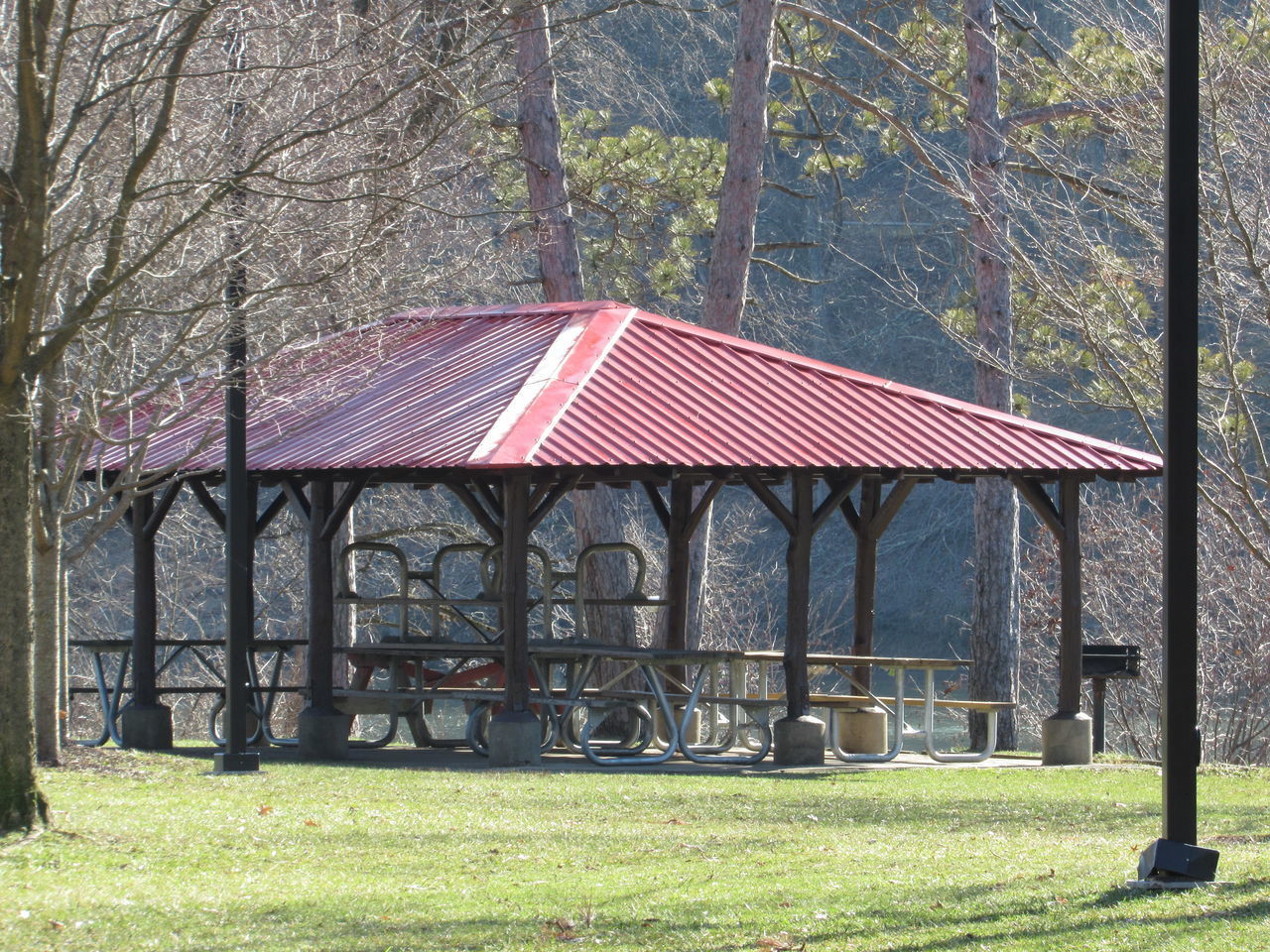 BUILT STRUCTURE ON FIELD AGAINST TREES