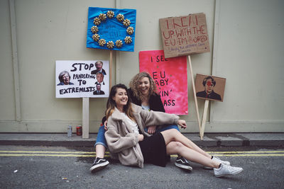 Young woman sitting with text