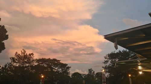 Low angle view of built structure against sky at sunset