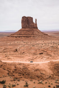 Rock formations in desert against sky