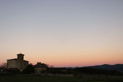 Scenic view of cathedral against clear sky during sunset