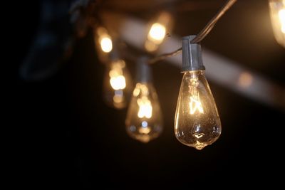 Close-up of illuminated lighting equipment at night