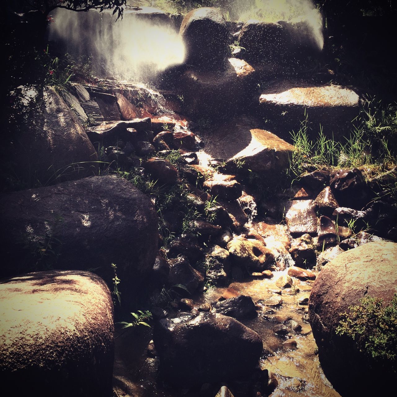 water, rock - object, stone - object, high angle view, nature, reflection, tranquility, sunlight, outdoors, no people, day, beauty in nature, pond, shadow, beach, stone, rock, shore, puddle, tranquil scene