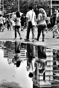 Group of people in puddle