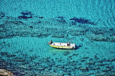 High angle view of sailboat sailing in sea