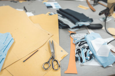 Tailoring equipment on a industrial clothing designer table