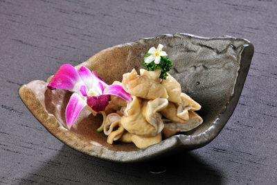 Close-up of pig intestines in bowl served on table