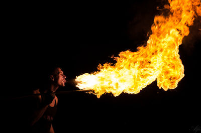 Fire-eater performing at night