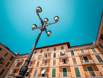 Low angle view of street light against sky