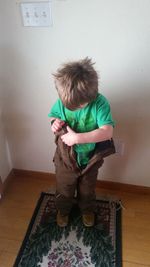 Boy standing at home