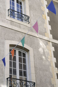 Low angle view of flag against building