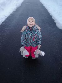 Portrait of a smiling girl in snow