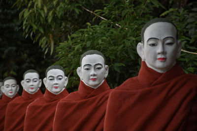 Statue of buddha in row