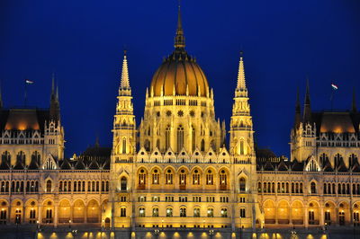 View of illuminated cathedral against sky at night