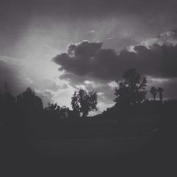 Scenic view of landscape against cloudy sky