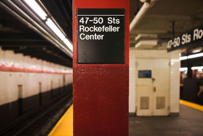 Information sign on subway station platform. 