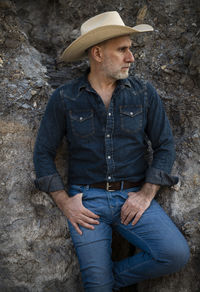 Portrait of man in cowboy hat and jeans