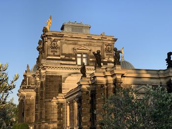 Low angle view of historical building against blue sky