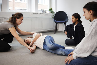 Teacher giving first aid training