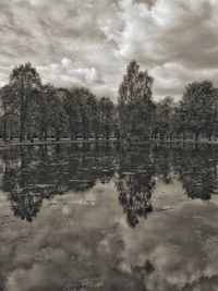 Reflection of trees in lake against sky