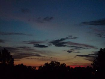 Silhouette of trees against sky at sunset