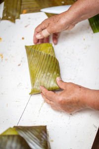 High angle view of person preparing food on table