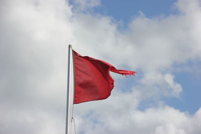 Low angle view of flag against sky